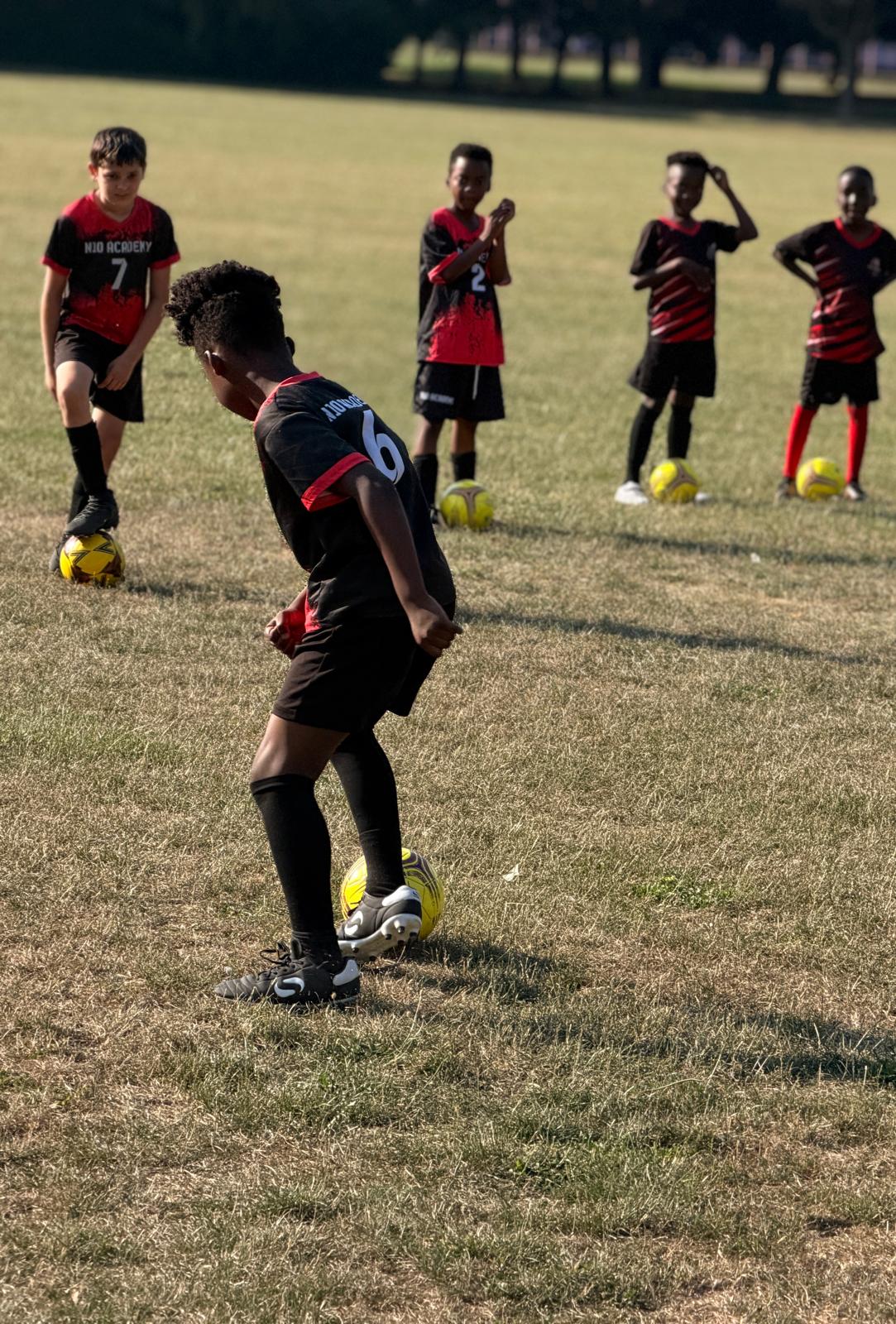 Young N10 Academy player practising close control with the ball